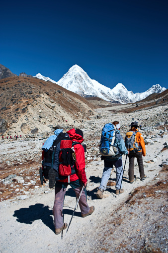 Group of trekkers in Mount Everest National Park. This is the highest national park in the world, with the entire park located above 3,000 m ( 9,700 ft). This park includes three peaks higher than 8,000 m, including Mt Everest. Therefore, most of the park area is very rugged and steep, with its terrain cut by deep rivers and glaciers. Unlike other parks in the plain areas, this park can be divided into four climate zones because of the rising altitude. The climatic zones include a forested lower zone, a zone of alpine scrub, the upper alpine zone which includes upper limit of vegetation growth, and the Arctic zone where no plants can grow. The types of plants and animals that are found in the park depend on the altitude.http://bem.2be.pl/IS/nepal_380.jpg