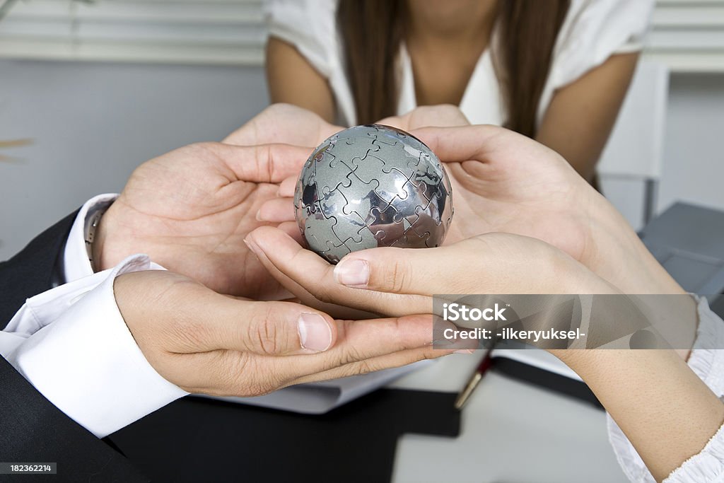 Globe Business group holding globe Adult Stock Photo