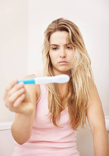istock Girl curious to know her pregnancy test results 182363093