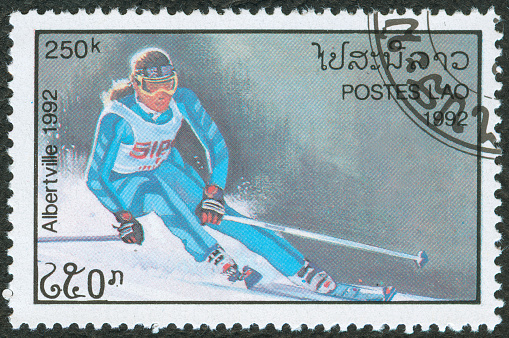 Male freestyle skier flying in the air.