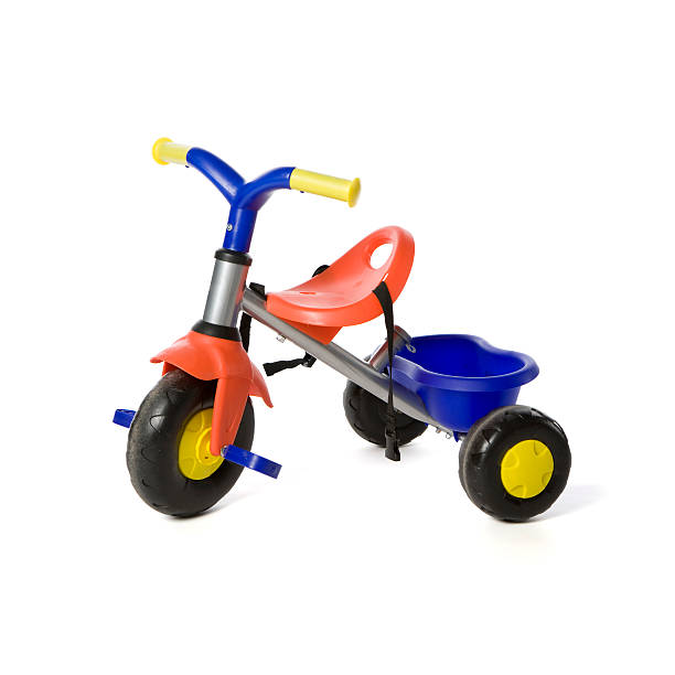 Children toy tricyle Isolated on white photograph of a generic toy tricyle. tricycle stock pictures, royalty-free photos & images