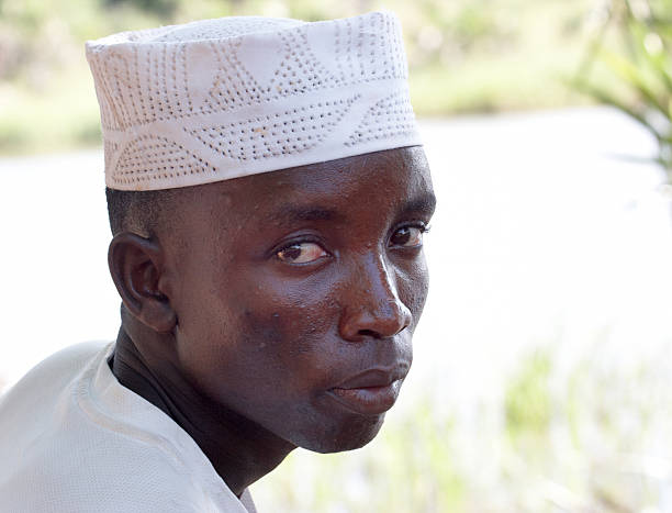 Young kenyan man wearing an islamic cap known as a taqiyah