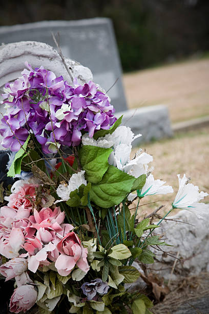 istock Colorful Flowers on Tombstone at a Cemetery 182364037
