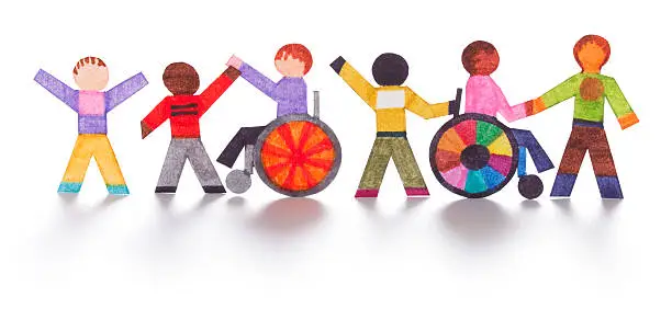 Integration of handicapped people. Two wheelchair bound individuals having fun with four friends/helpers. Banner format.