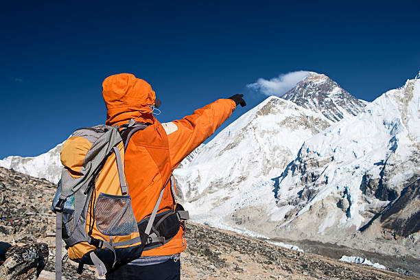 istock Female trekker pointing at Mount Everest 182364696