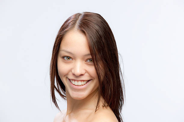 istock shirtless smiling young woman 182364902