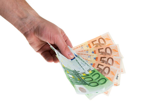 istock Euro banknotes in hand 182365275
