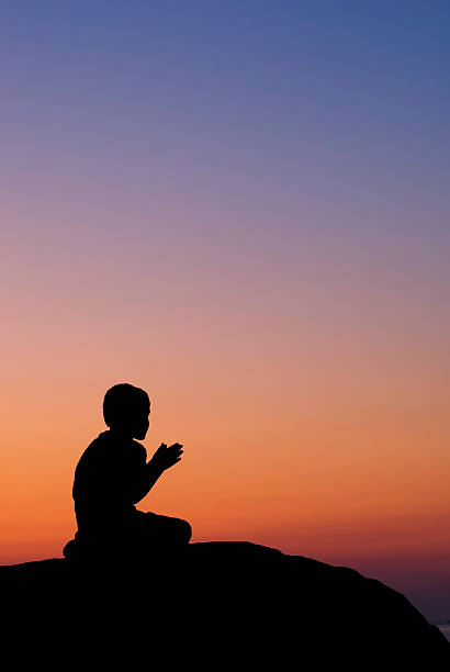 istock Little Boy Praying At Sunset - II 182365916