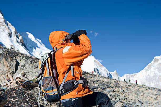 istock Female trekker looking over Himalayas 182366011