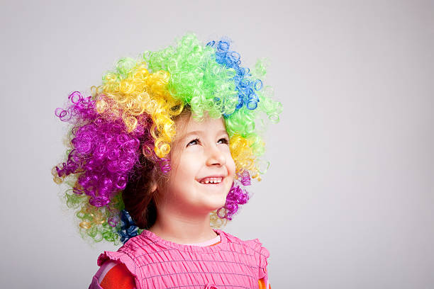 istock Little girl with a colorful wig 182366253
