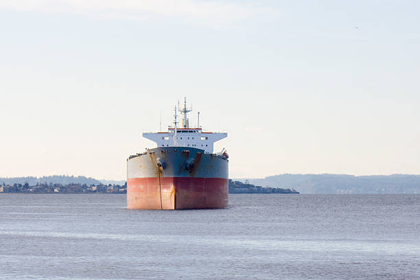 istock Head-on View of Empty Cargo Ship at Anchor 182367515