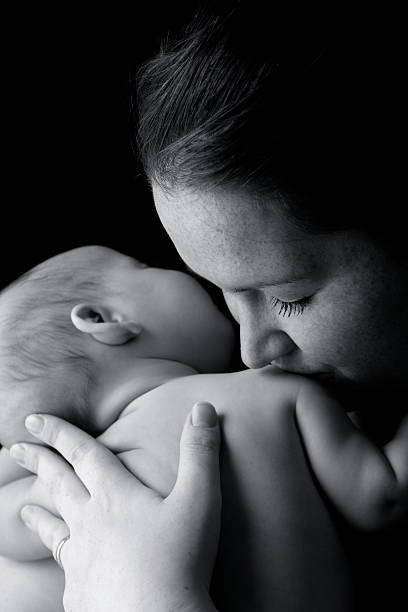 istock Mother Kissing Baby 182368254