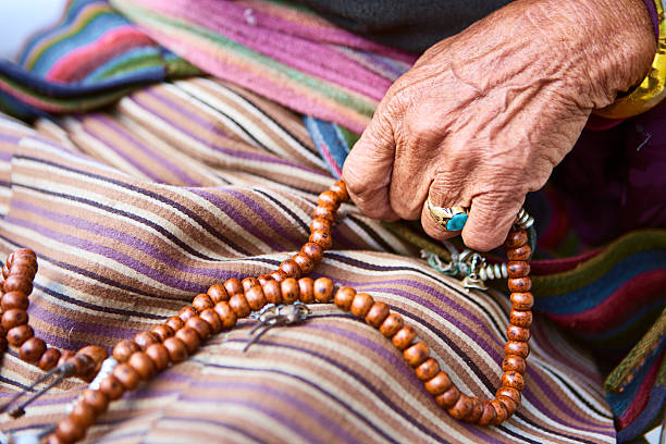 istock Nepali woman with rosary 182368851