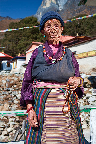 istock Nepali woman with rosary 182368857
