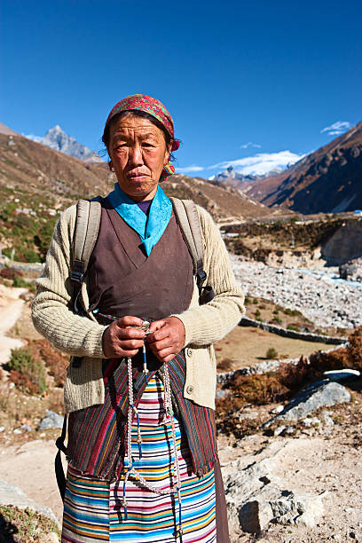 istock Nepali woman with rosary 182369424