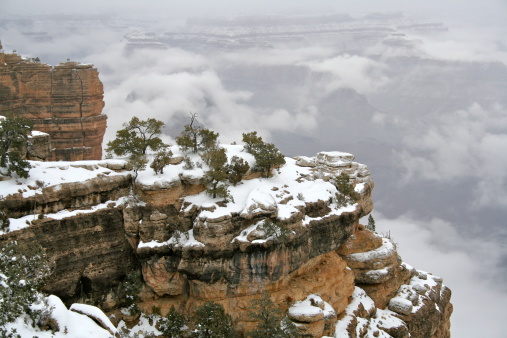 Breathtaking view of the Grand Canyon with a blanket of snow.