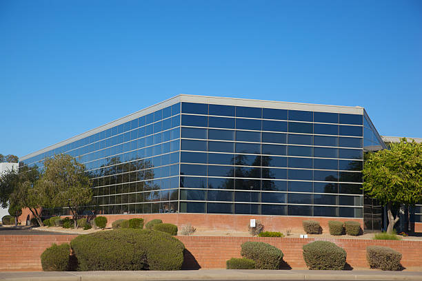 Scottsdale Business Building Scottsdale Arizona business building on a clear day with desert landscaping set on a bright blue clear sky background southwest usa architecture building exterior scottsdale stock pictures, royalty-free photos & images