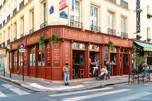 Paris France 12 September 2021, people are drinking coffee on the terrace of a cafe restaurant during the Autumn end of summer.