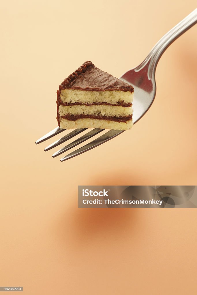 Tiny Piece of Cake on Fork "Tiny piece of cake on a fork.  This is not a composite photo. I actually baked a tiny cake with three layers, frosted it, decorated it, cut a slice out with a tiny knife, and put it on the fork.Great for illustrating all kinds of food and dieting concepts.Perhaps you need a tiny cheeseburger instead" Small Stock Photo