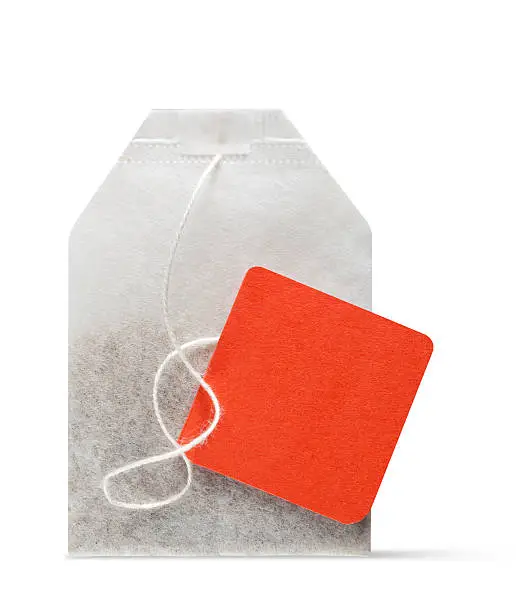 Tea bag with orange label. Photo with clipping path.Similar photographs from my portfolio: