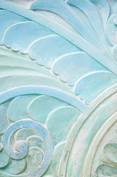 Wavy Stonework Art Deco Pattern Close-Up Wavy organic leafy pattern carved into light stone south beach photos stock pictures, royalty-free photos & images
