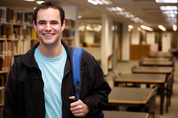 istock Smiling Student in the College School Library 182370115