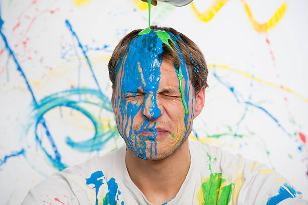 Man with paint on his head stock photo