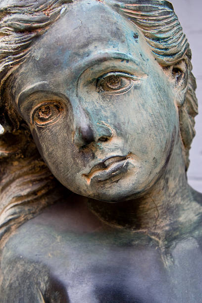 istock Bronze Sad Faced Girl Statue 182370528