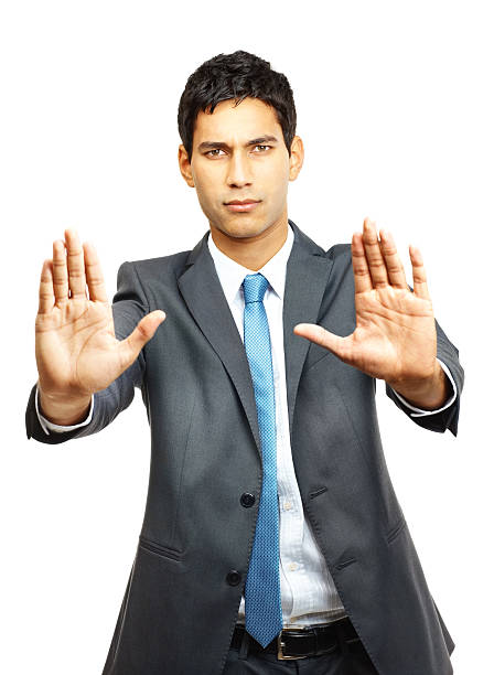 istock Confident young businessman gesturing stop sign 182370801