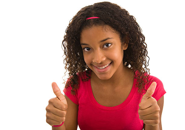 teenager weiblich geben die daumen hoch mit beiden händen - thumbs up african descent teenager women stock-fotos und bilder