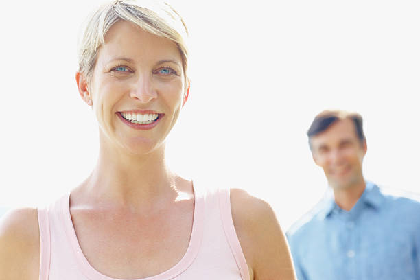 istock Woman smiling with husband at the back 182371476