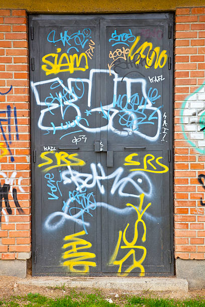 Graffiti: vandalism or urban art. Series I select a detail of graffiti. I like some forms and color combinations purple graffiti metallic wall stock pictures, royalty-free photos & images