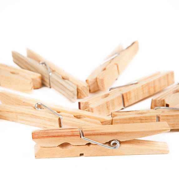 istock Wooden clothespins on white 182372384