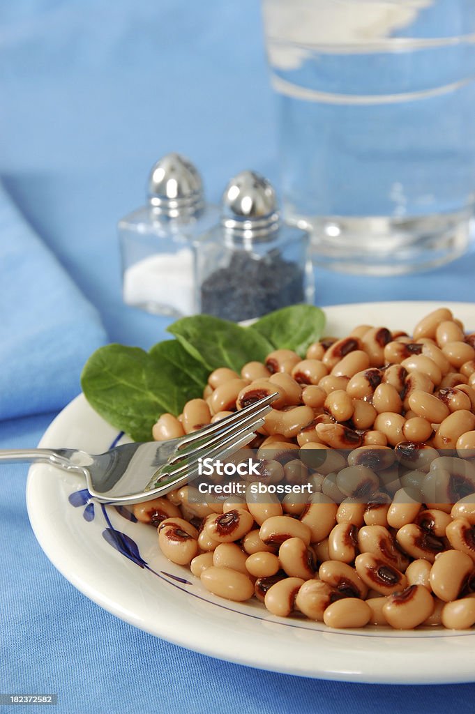 Black Eyed Peas "A dish of black eyed peas.More pulled pork, collard greens, black-eyed peas, and other good-luck foods for the New Year:" American Culture Stock Photo