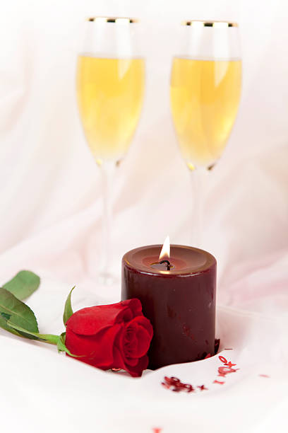 Valentines Day Series "candle, rose and champagne for Valentines Day on pink satinCheck out my Love & Valentine's Series" flaming o symbol stock pictures, royalty-free photos & images