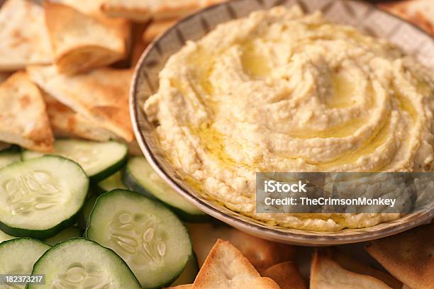A Bowl Of Fresh Hummus And Cucumbers Stock Photo - Download Image Now - Hummus - Food, Cucumber, Chick-Pea