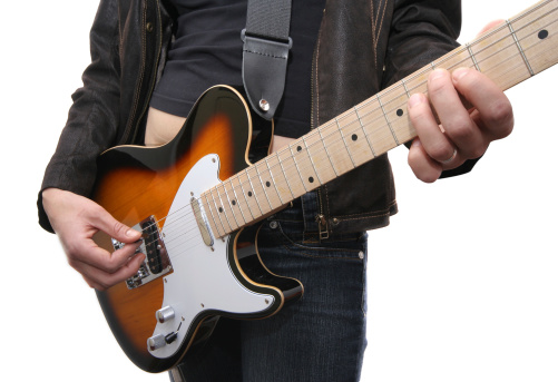 Woman playing on guitar on white background