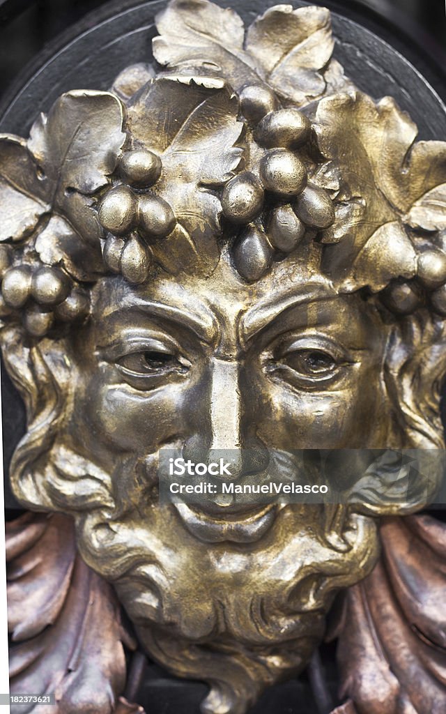 bronze face "mythological creature in the doorway of an old building, madrid" Bronze - Alloy Stock Photo