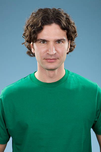 istock Young man with blank green shirt 182373770
