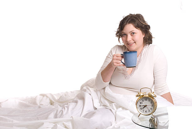 istock Woman With Coffee In Bed 182373939