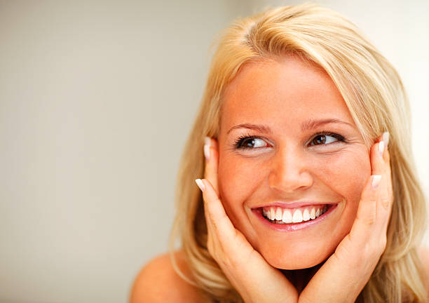 istock Closeup of a smiling young lady 182374052