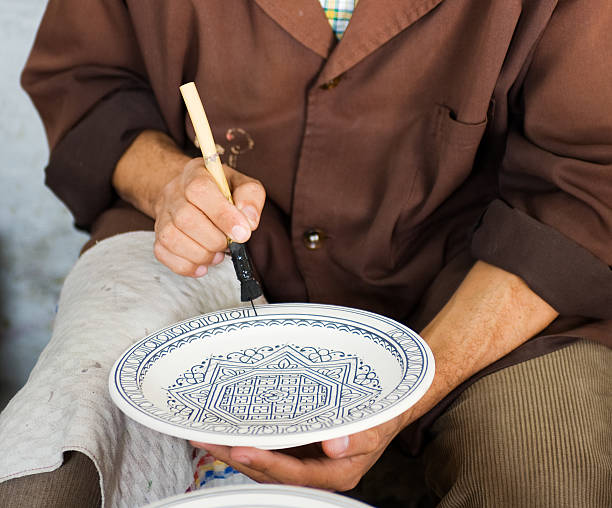 Painting a decorative plate in Morocco
