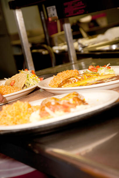 Mexican Food Being Prepared at a Tex-Mex Restaurant Kitchen Mexican Food Being Prepared at a Tex-Mex Restaurant Kitchen.See more from this series: mex mexican restaurant tex stock pictures, royalty-free photos & images