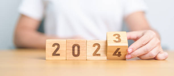 istock 2023 change to 2024 year block on table. goal, Resolution, strategy, plan, start, budget, mission, action, motivation and New Year concepts 1823746293