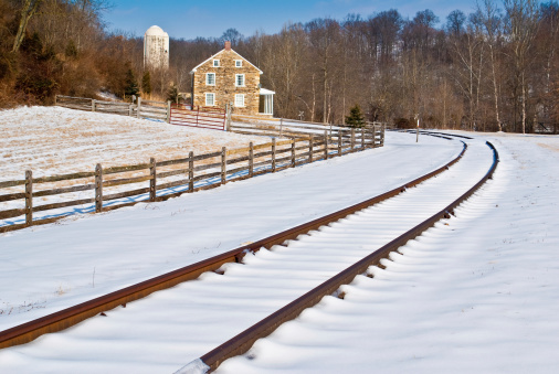 A old stone house along snow covered railroad tracks.I invite you to view some of my other Winter images: