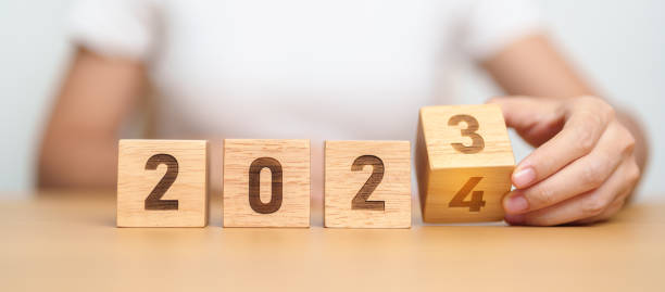 istock 2023 change to 2024 year block on table. goal, Resolution, strategy, plan, start, budget, mission, action, motivation and New Year concepts 1823748925