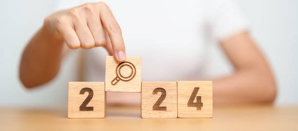 istock 2024 block with magnifying glass icon. SEO, Search Engine Optimization, hiring , Advertising, Idea, Strategy, marketing, Keyword, Content and New Year start concepts 1823748929