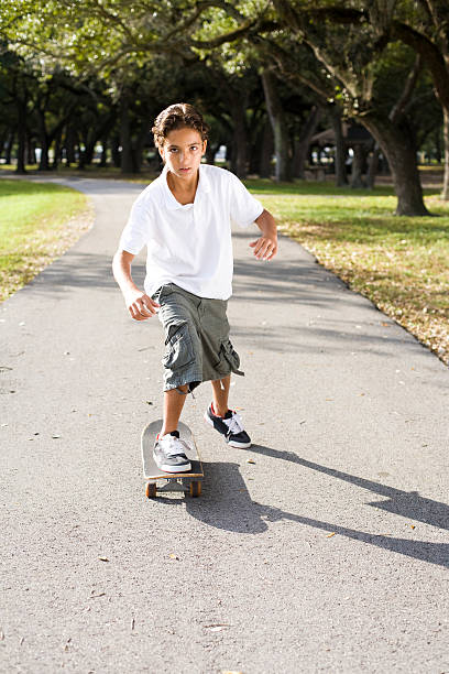 Boy Skateboarding stock photo