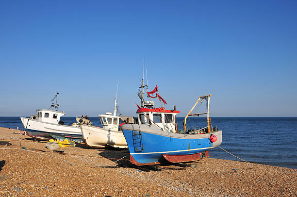istock Fishing boats pulled on the beach at Hythe, Kent, UK 182375398