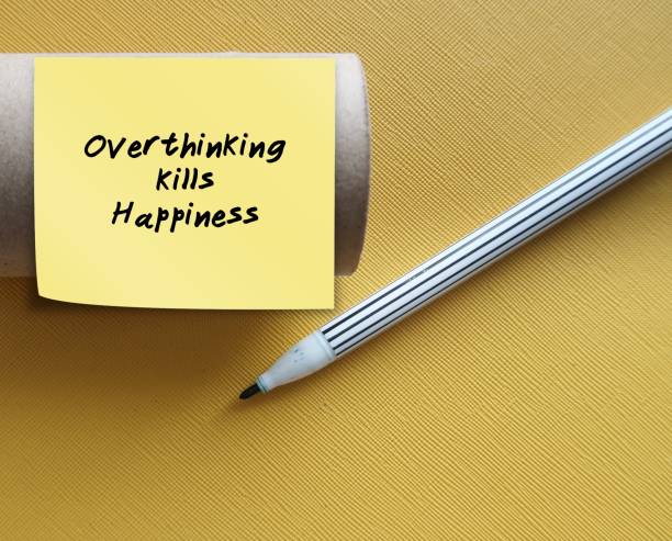 istock Toilet roll with stick note written OVERTHINKING KILLS HAPPINESS - to overcome overthinking which magnifies problems and creates fear, doubt, regret, and confusion 1823755674